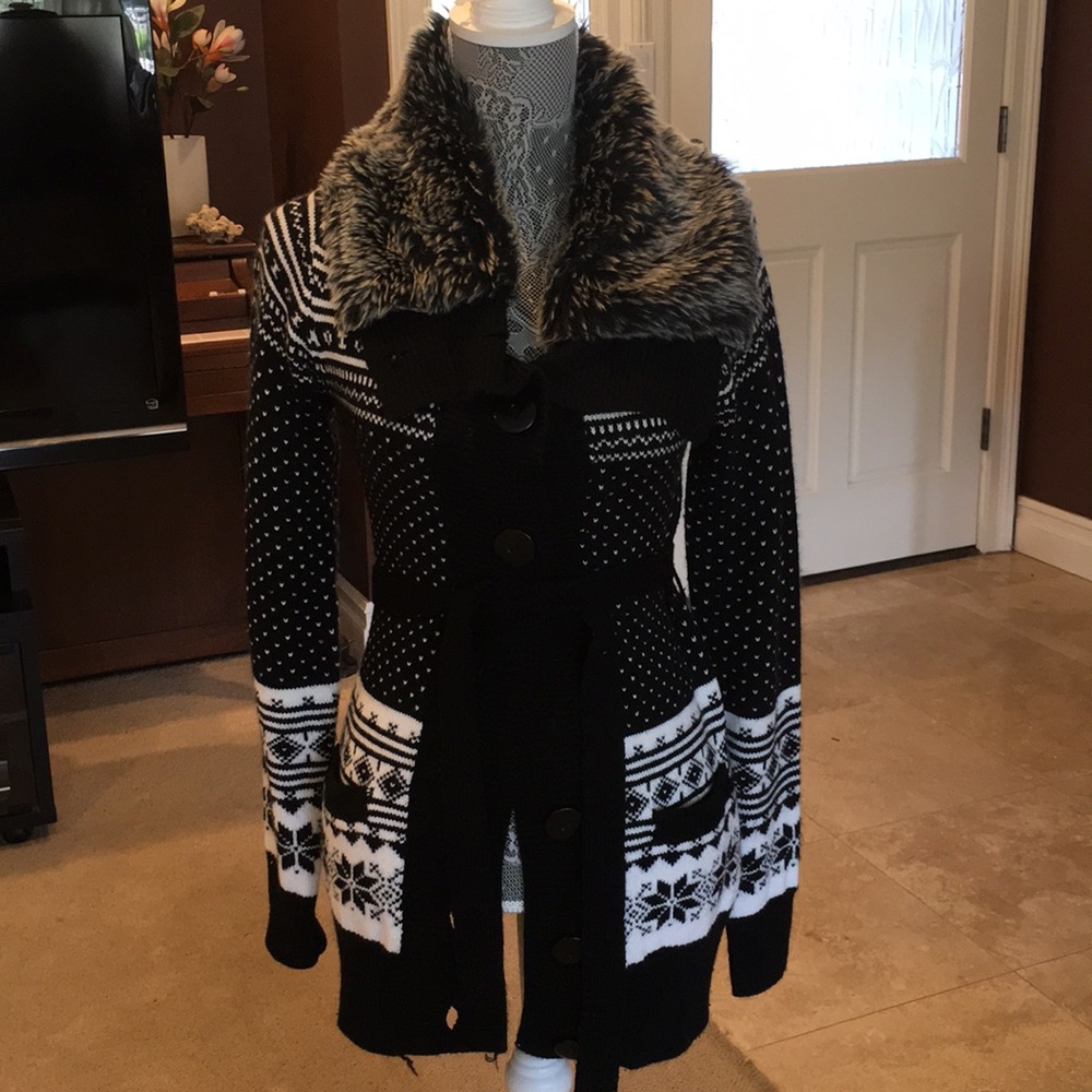 Delia’s long sweater with faux fur.